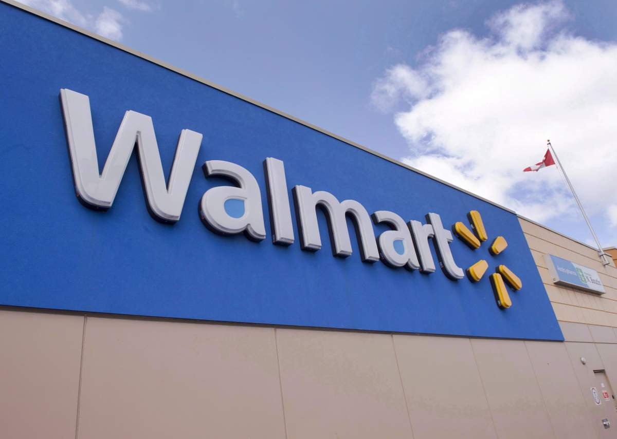 Signage at a Laval, Que., Walmart store is seen on May 3, 2016. Walmart Canada says it is starting to roll out one-hour grocery delivery today for customers in parts of the Greater Toronto Area.