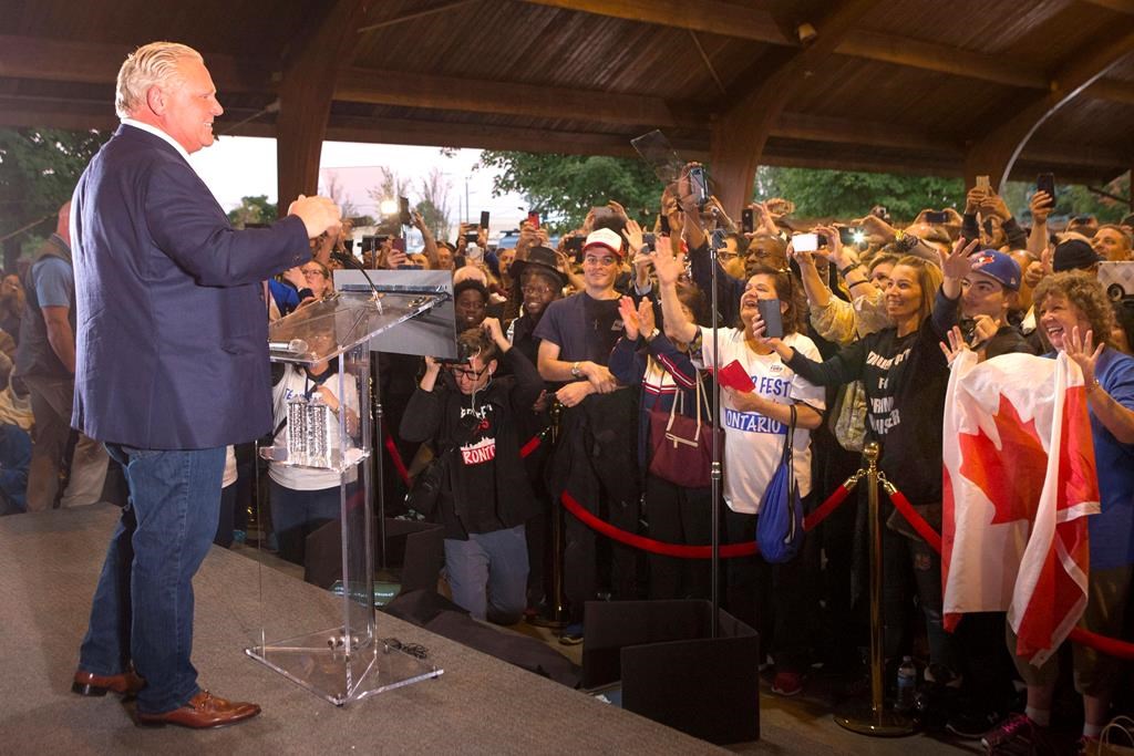 Ontario Premier Doug Ford greets the crowd as he takes the stage at Ford Fest in Vaughan , Ontario, on September 22, 2018.