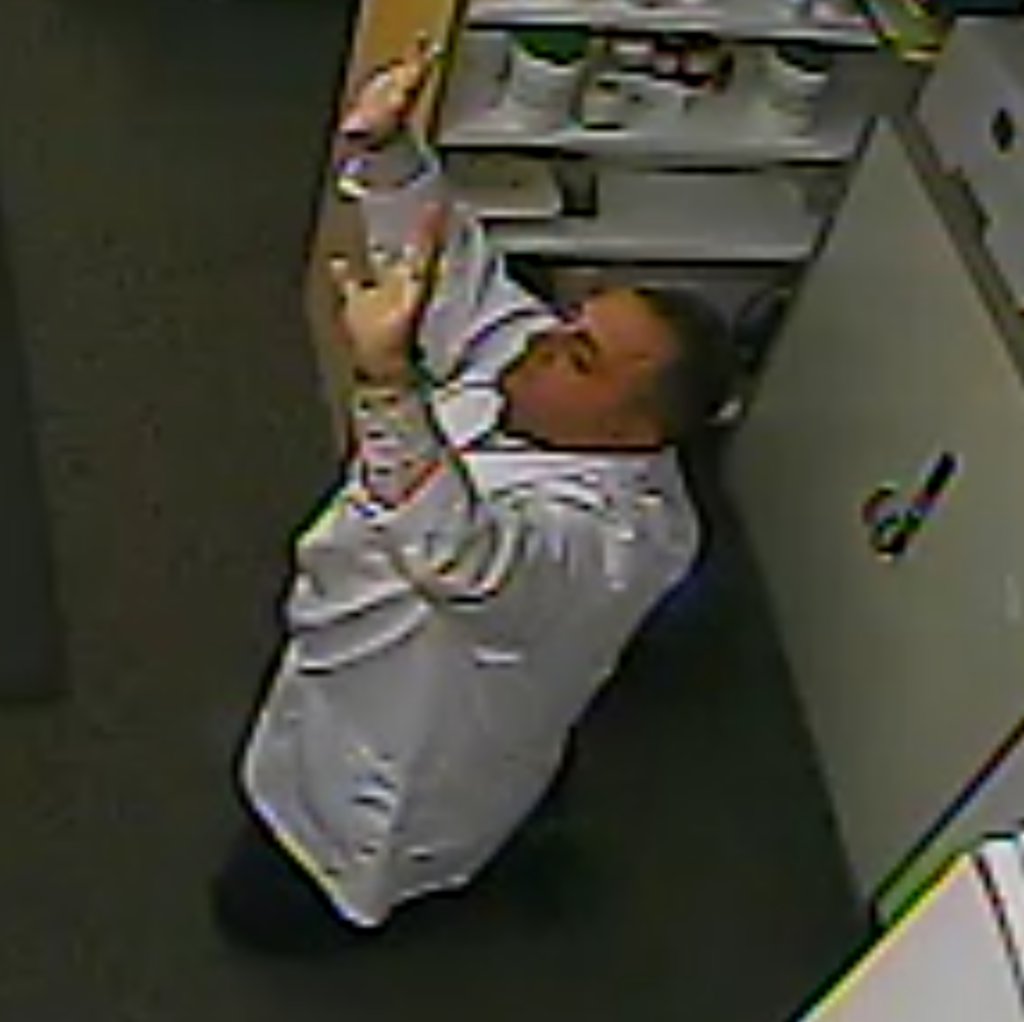 Waseem Shaheen seen in surveillance video during a knifepoint robbery at his Ottawa pharmacy in October 2014. (Global News)
