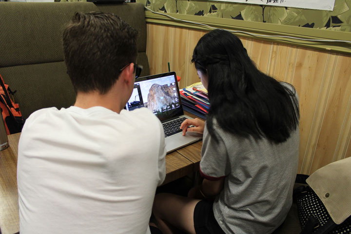 Silas Young and Wendy Wang at work on their video on addiction and substance abuse.