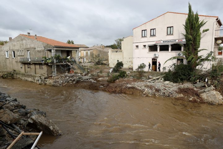 French firefighters inspect damaged houses after heavy rain falls, flash floods and violent storm that hit Aude department overnight in Villegailhenc, France, Oct. 15, 2018.