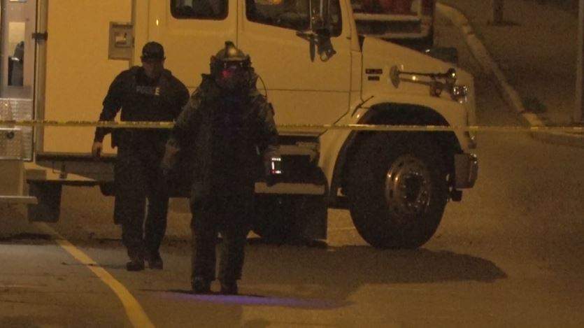 A member of the RCMP Explosives Disposal Unit arrives at a Nanaimo tent city on Friday night.