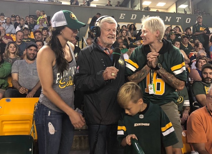 Bryan Hall is joined by boxer Jelena Mrdjenovich and rugby player Jen Kish to sing the fight song at an Edmonton Elks game.