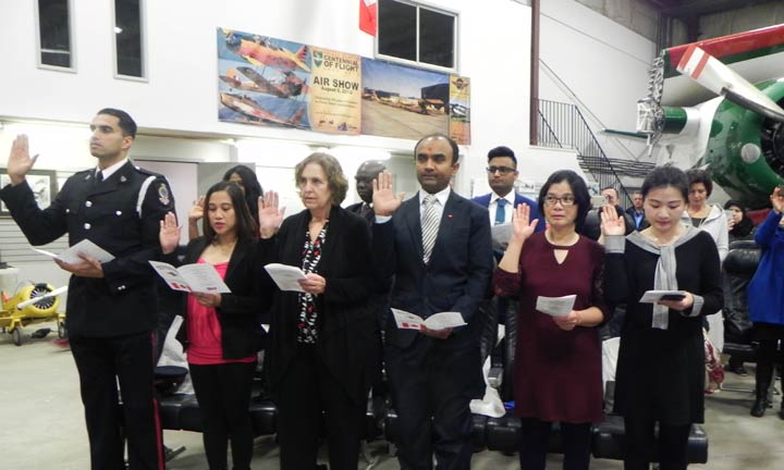Twenty-five people become Canadian citizens at a special ceremony at the Saskatchewan Aviation Museum Tuesday.