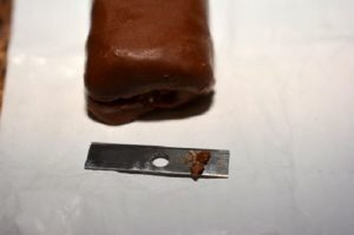 Toronto police issued a public safety alert after a man found a razor blade in his chocolate bar on Saturday.