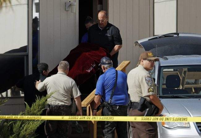 Authorities remove the body of Dennis Hof from the Love Ranch brothel in Pahrump, Nev., Oct. 16, 2018.