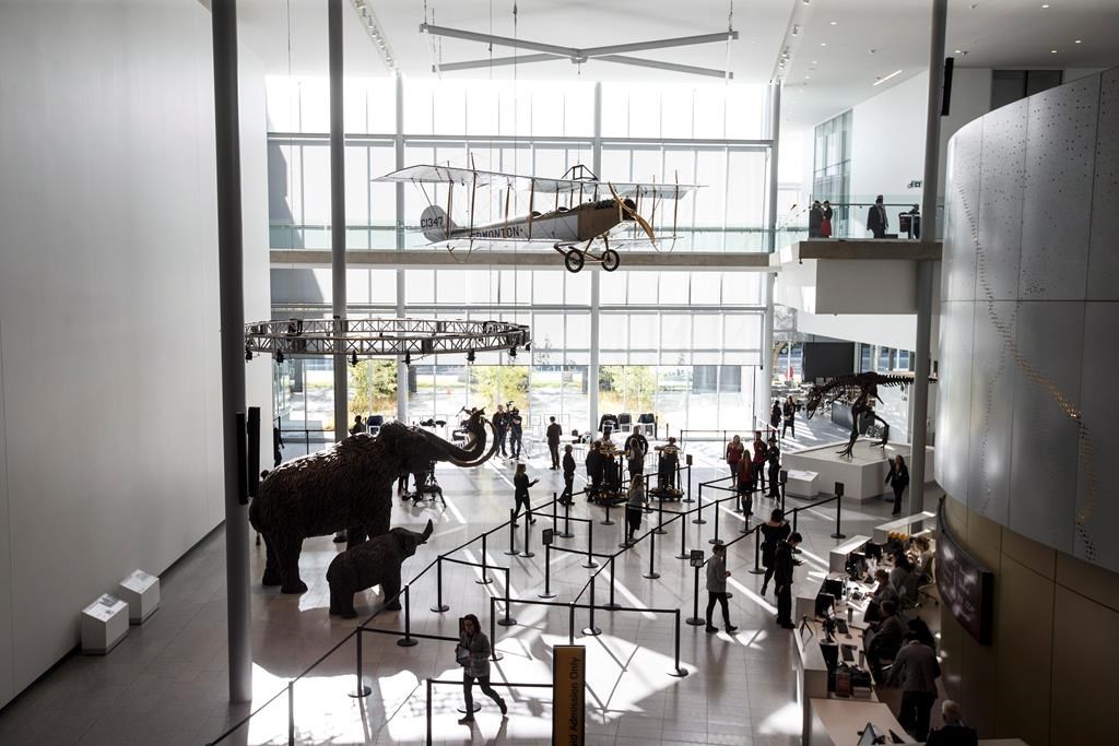 A crowd enters the Royal Alberta Museum on opening day, in Edmonton on Wednesday, Oct. 3, 2018. THE CANADIAN PRESS/Jason Franson