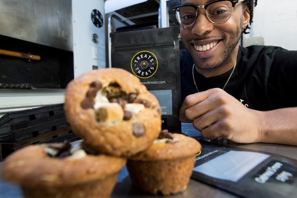 Yannick Craigwell shows off some of his edible marijuana baked treats in Vancouver, Wednesday, Oct. 3, 2018.