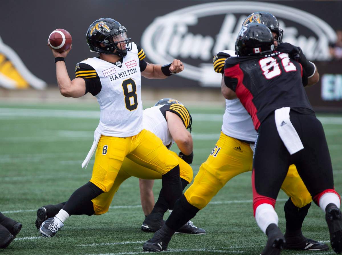 Hamilton Tiger-Cats quarterback Jeremiah Masoli (8) throws during first half CFL football game action against the Ottawa Redblacks in Hamilton, Ont. on Saturday, July 28, 2018.