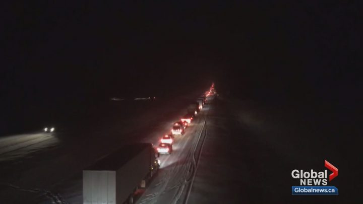 Drivers were stranded for up to 11 hours on Highway 1 near Canmore after a massive snowfall on Tuesday.