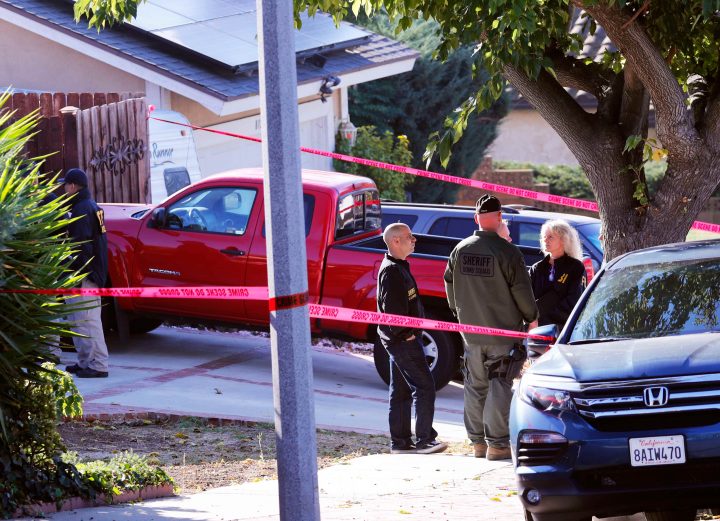 Police and FBI officers wait outside the home of the suspect in a shooting incident at a Thousand Oaks bar, in Newbury Park, California, U.S. Nov. 8, 2018.