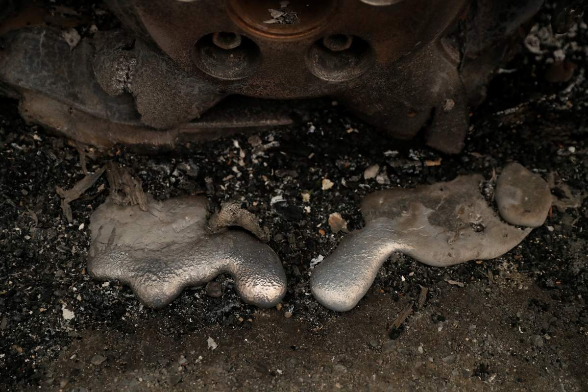 The remains of a burned vehicle destroyed by the Camp Fire are seen in Paradise, California, U.S. November 9, 2018.