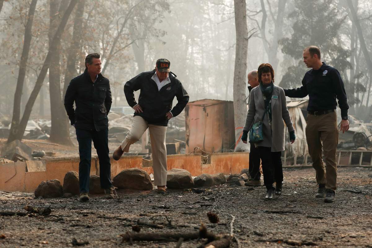 U.S. President Donald Trump visits the charred wreckage of Skyway Villa Mobile Home and RV Park in Paradise, Cali., on November 17, 2018.