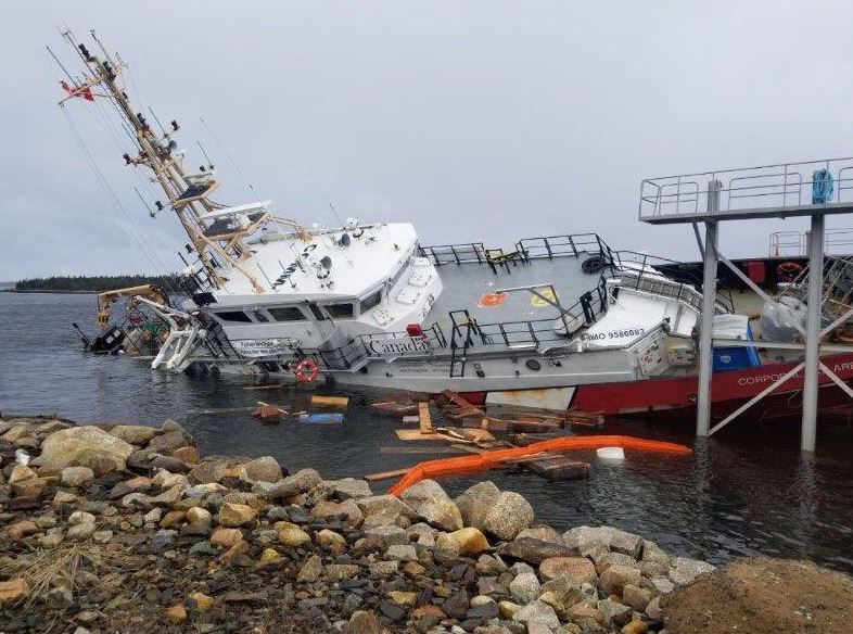 The vessel slipped from its cradle, crashing into the ocean floor and coming to rest partially submerged in the icy water of Sambro Harbour.