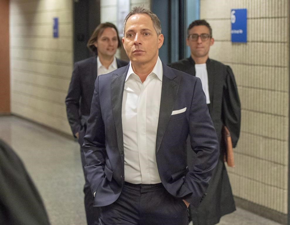 Yanai Elbaz, front, and his brother Yohann Elbaz, left, arrive for their fraud trial at the courthouse in relation to the MUHC hospital Monday, November 26, 2018 in Montreal.