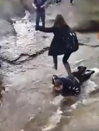 Advocates say a disturbing video showing a Cape Breton teen's classmates walking over him in a stream demonstrates how the lives of people with disabilities are often devalued. A screengrab from the video posted to Facebook is shown in a handout.