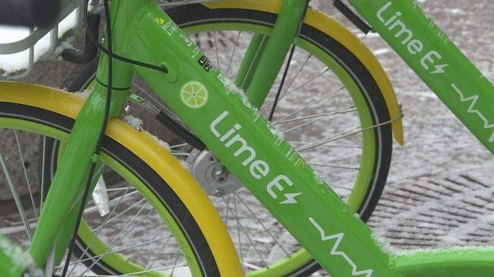 Lime electric bikes outside of Calgary City Hall.