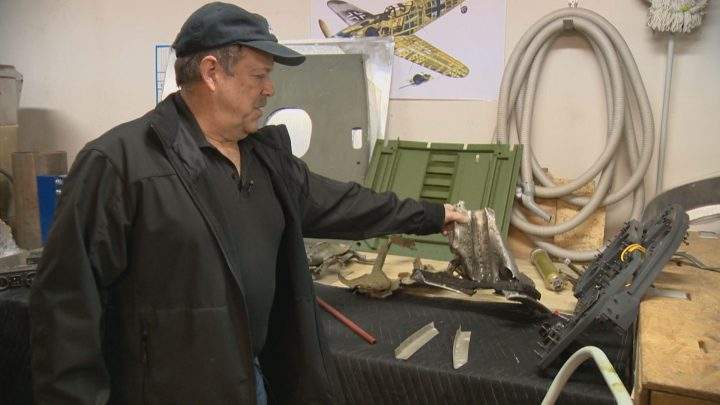 Bradshaw holding some of the original wreckage.