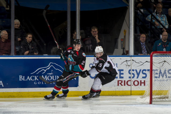 KELOWNA, CANADA - NOVEMBER 28:  Owen Hardy #15 of the Vancouver Giants stick checks Lassi Thomson #2 of the Kelowna Rockets during second period on November 28, 2018 at Prospera Place in Kelowna, British Columbia, Canada.  (Photo by Marissa Baecker/Shoot the Breeze).