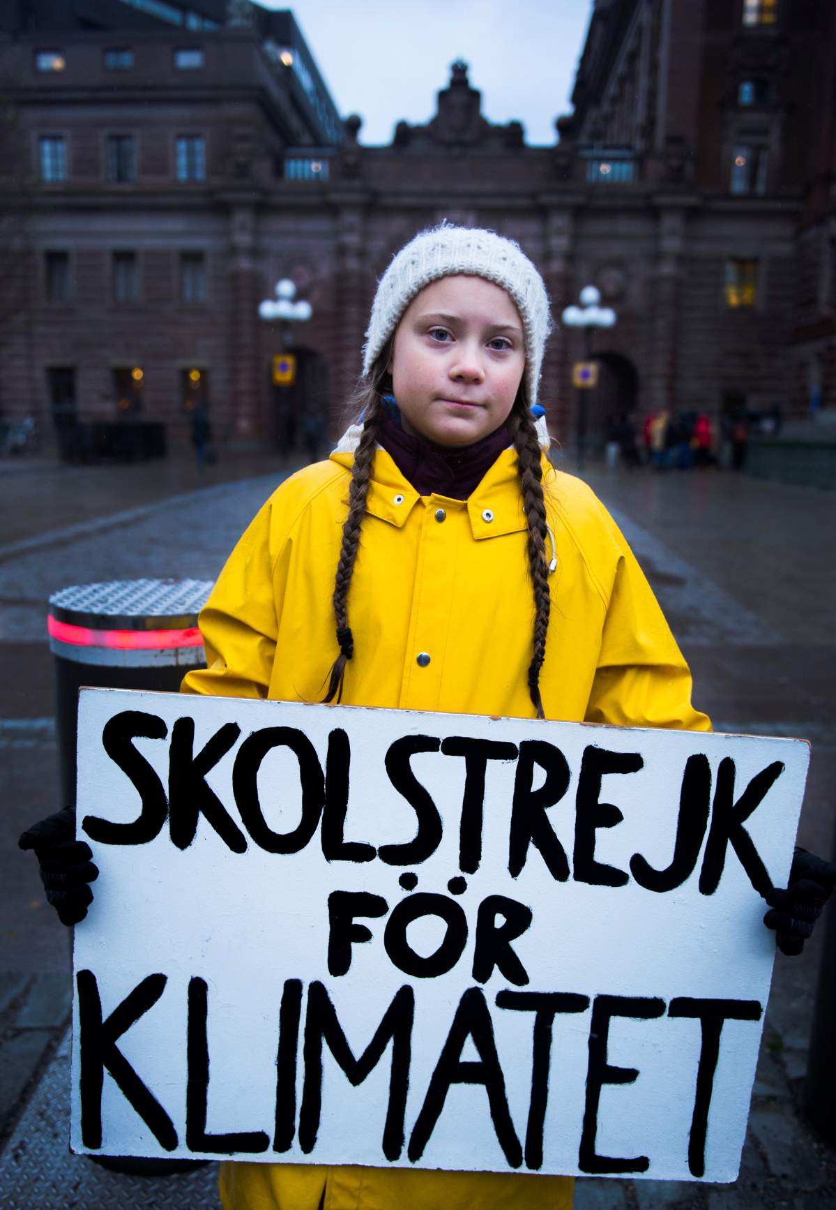 15-year-old Swedish girl Greta Thunberg holds a placard reading “School strike for the climate” during a manifestation against climate change outside the Swedish parliament in Stockholm, Sweden, on Nov. 30, 2018. TT News Agency/Hanna Franzen via REUTERS