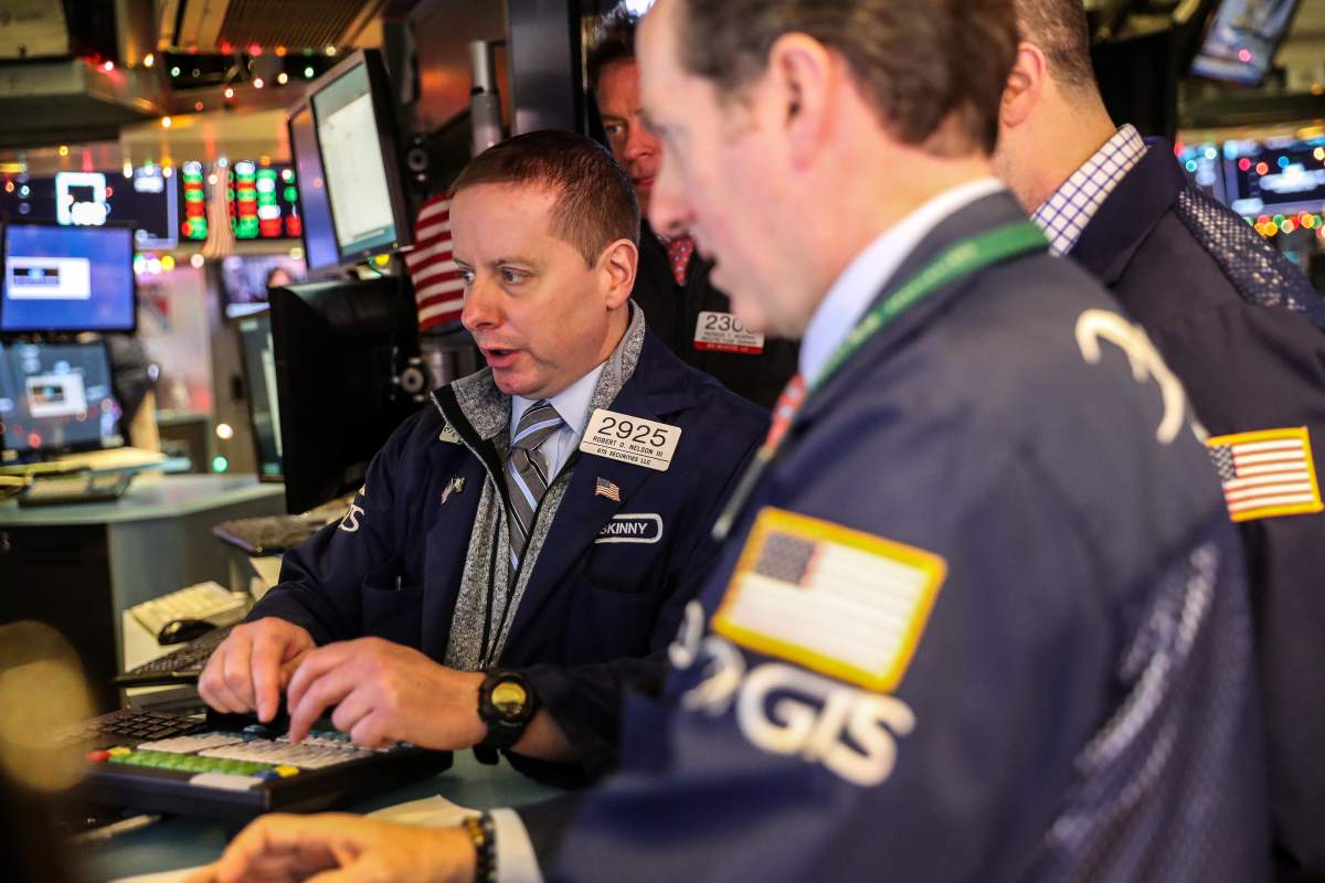 Traders work on the floor of the New York Stock Exchange (NYSE) in New York, U.S., December 28, 2018. 