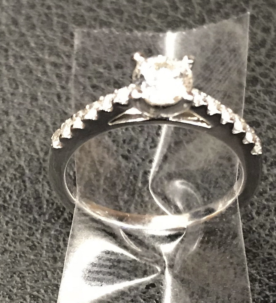 In this Dec. 1, 2018 photo provided by the New York City Police Department, an engagement ring recovered by the NYPD below a Times Square utility grate is shown in New York.