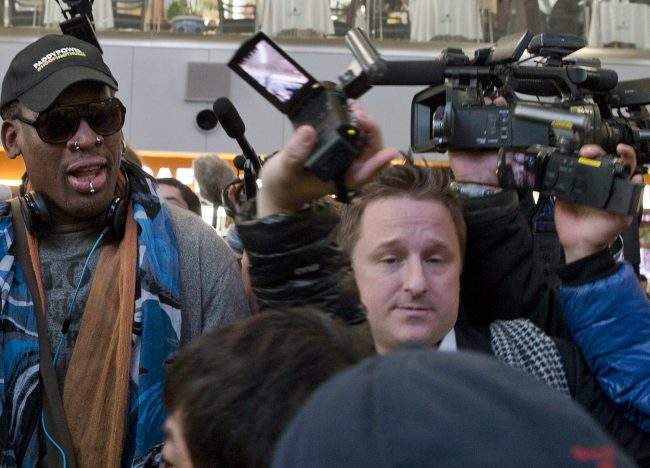 In this Dec. 19, 2013 file photo, Michael Spavor is seen with former NBA star Dennis Rodman on his arrival at Beijing airport for a flight to North Korea..