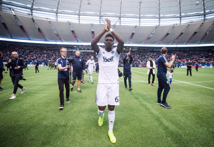 Vancouver Whitecaps midfielder Alphonso Davies salutes the crowd after playing his final match as a member of the MLS soccer team in Vancouver on October 28, 2018. 