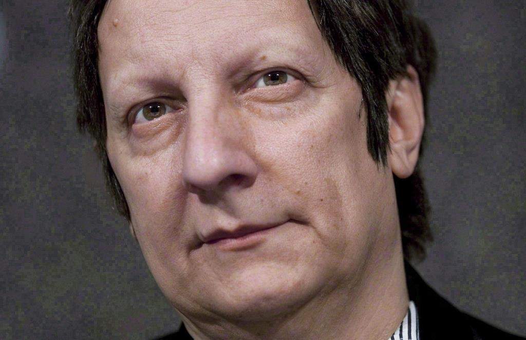 Canadian playwright, actor, film director and stage director Robert Lepage speaks to reporters at the National Arts Centre in Ottawa on November 10, 2010.