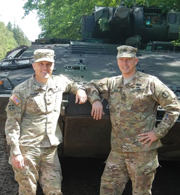 Former U.S. Army Col. Bryan Denny, right, is shown in this file photo.