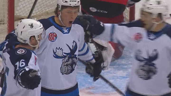 Manitoba Moose forward Austin Carroll celebrates his first goal with the team on Friday against the Grand Rapids Griffins.