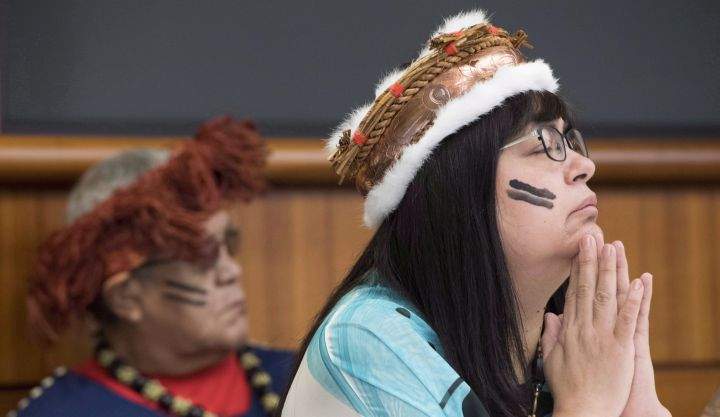 Chief Marilyn Slett pauses for a moment during a news conference in Vancouver, Wednesday, Oct. 10, 2018. The news conference was to announce the suing of Kirby Corporation by the Heiltsuk government regarding the sinking of an American-owened tug named "Nathan E. Stewart" after it ran aground Oct. 13 2016. 