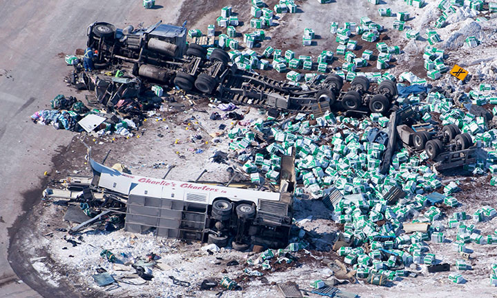 The wreckage of a fatal crash outside of Tisdale, Sask., is seen Saturday, April, 7, 2018. A bus carrying the Humbolt Broncos hockey team crashed into a truck en route to Nipawin killing 14 and sending over a dozen more to the hospital.
