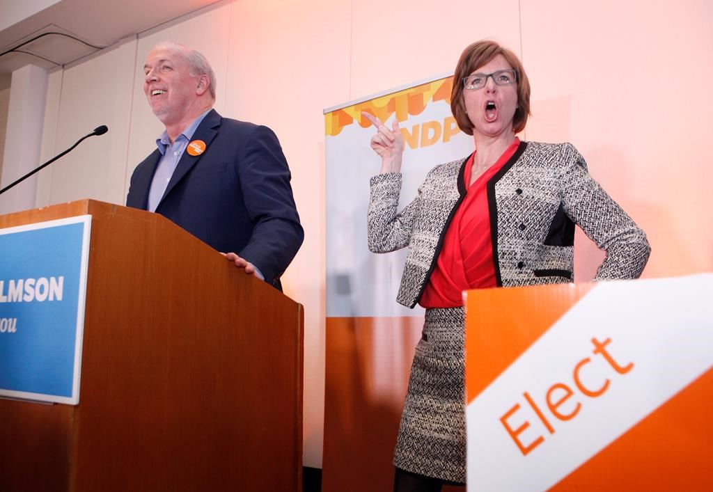 NDP candidate Sheila Malcolmson celebrates with Premier John Horgan after winning the byelection in Nanaimo, B.C., on Wednesday, January 30, 2019. The New Democrats won a key provincial byelection in British Columbia on Wednesday that allows Premier John Horgan\’s minority government to maintain its grip on power.