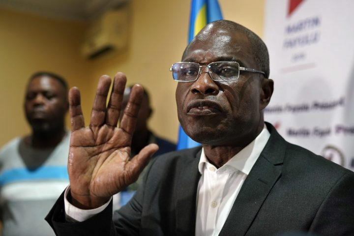 Opposition candidate Martin Fayulu speaks to the press at his headquarters in Kinshasa, Congo, Thursday Jan. 10, 2019.