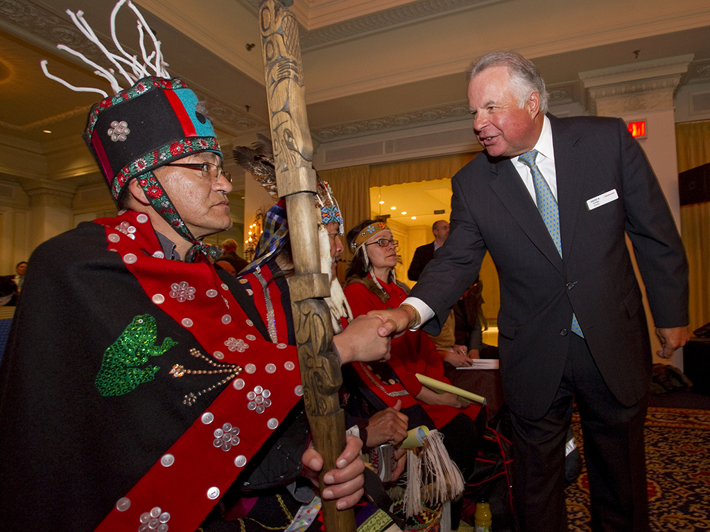 Chair of the Board, David Arledge (R) greets Hereditary Chief Na’Moks, of Tsayu Clan, Wet’suwet’en band at the King Edward Hotel in Toronto.