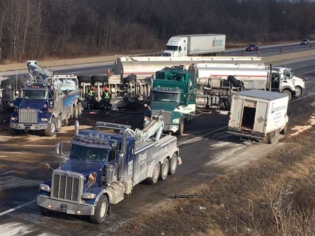 Crews cleaning up jet fuel after a tanker truck overturned on Highway 401 near Cambridge on Sunday.