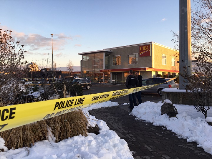 Yellow tape and police members can be seen outside the CIBC branch in Kelowna on Wednesday afternoon.