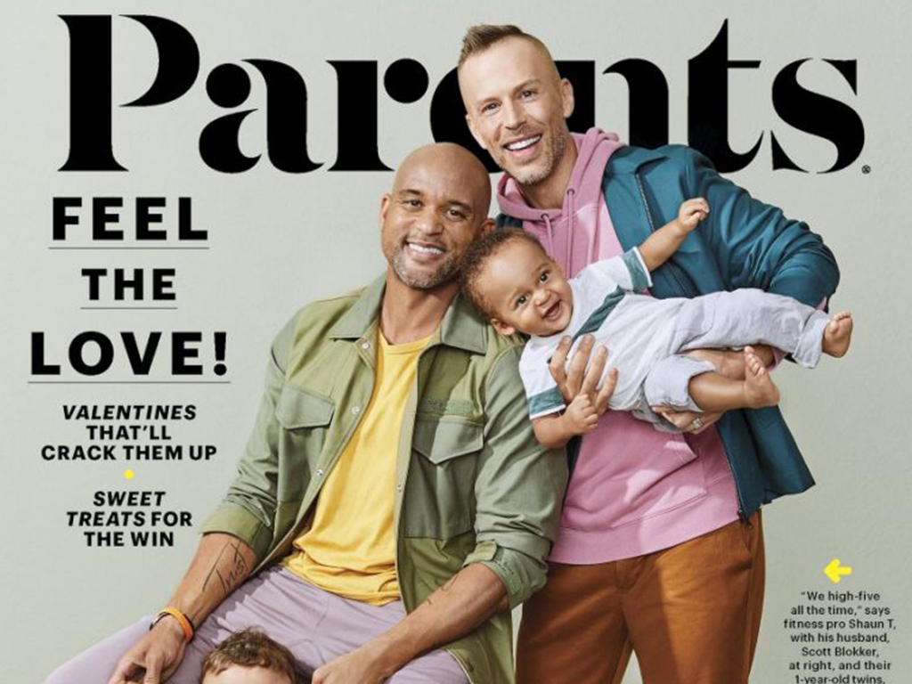 Fitness trainer Shaun T and husband Scott Blokker on the cover of Parents magazine with their two sons. 