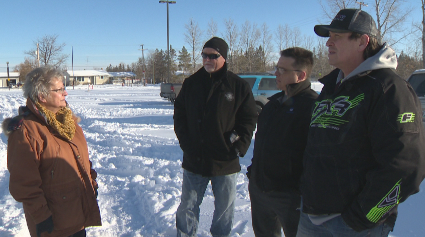 Frustrated parents, including Glenn Grove (right) and Darcy Gascoigne (middle), discuss their concerns with Mayor Joy Sul.