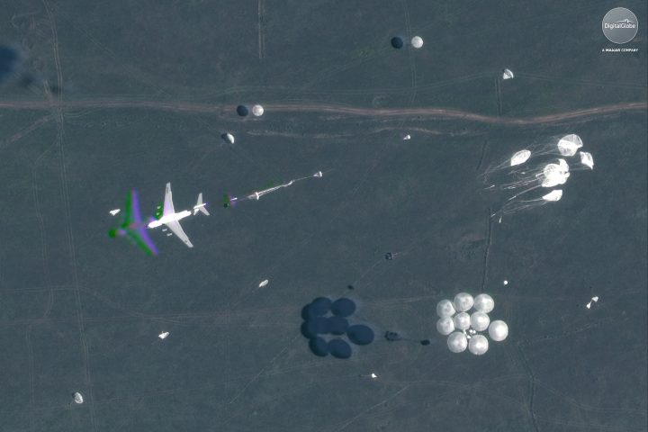 This Sept. 13, 2018 satellite image provided by DigitalGlobe shows an airborne paradrop during the Vostok military exercises in the Eastern Siberia area of Russia.