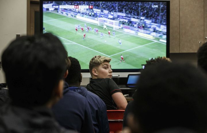 Students at St. Nicholas Catholic Junior High School watch the FC Bayern Munich vs TSG 1899 Hoffenheim on tv in Edmonton, Alta., on Friday January 18, 2019. Former Nicholas Catholic Junior High student, Alphonso Davies joined Bayern Munich in the new year, following a $22-million transfer from the Vancouver Whitecaps.