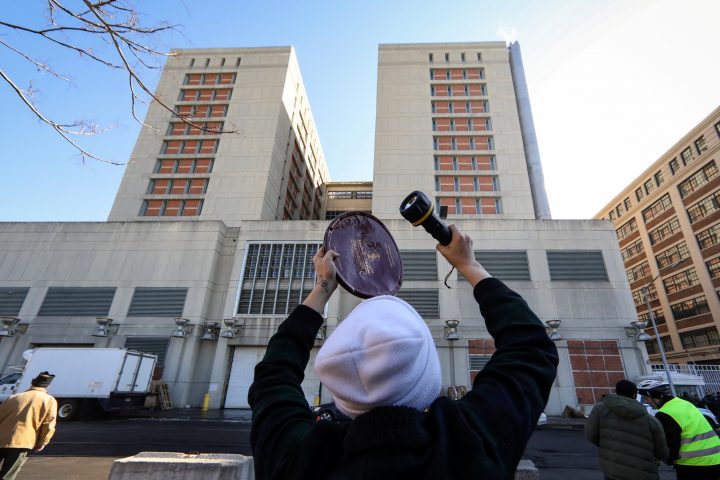 A demonstrators bangs on a piece of metal to communicate with prisoners inside the Brooklyn Metropolitan Detention Center, following a bomb threat in the Brooklyn borough of New York, U.S., Feb. 4, 2019.