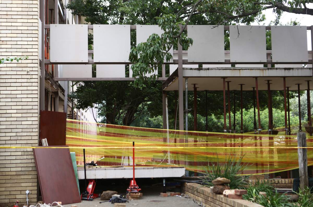 Police tape cordons off the site of a walkway collapse at the Driehoek High School in Vanderbijlpark, South Africa, Friday, Feb. 1, 2019. 