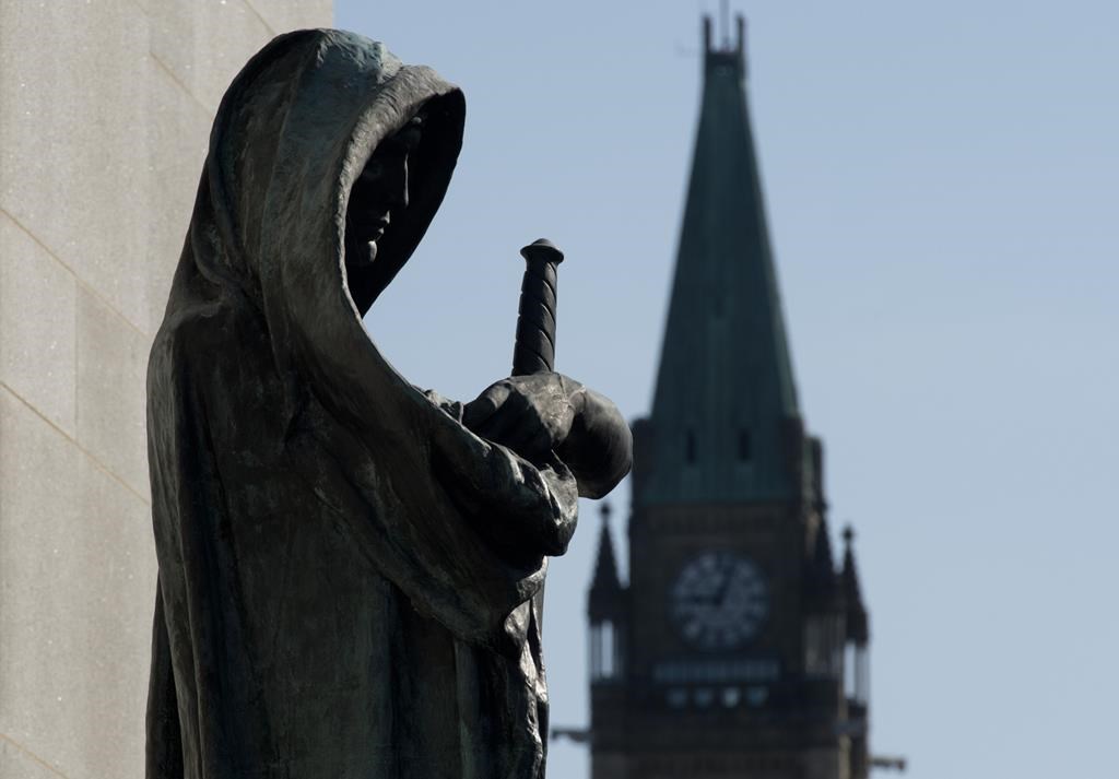 Veritas (Truth) guards the entrance of the Supreme Court of Canada in Ottawa.
