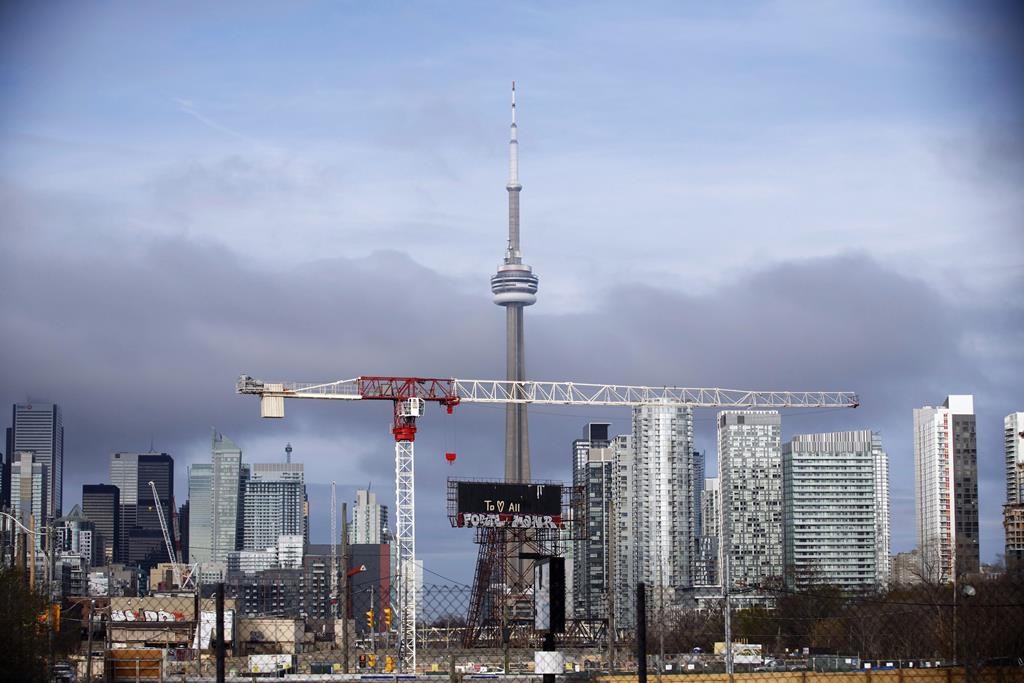 Condominiums and the CN Tower are shown along the Toronto skyline. THE CANADIAN PRESS/Cole Burston
