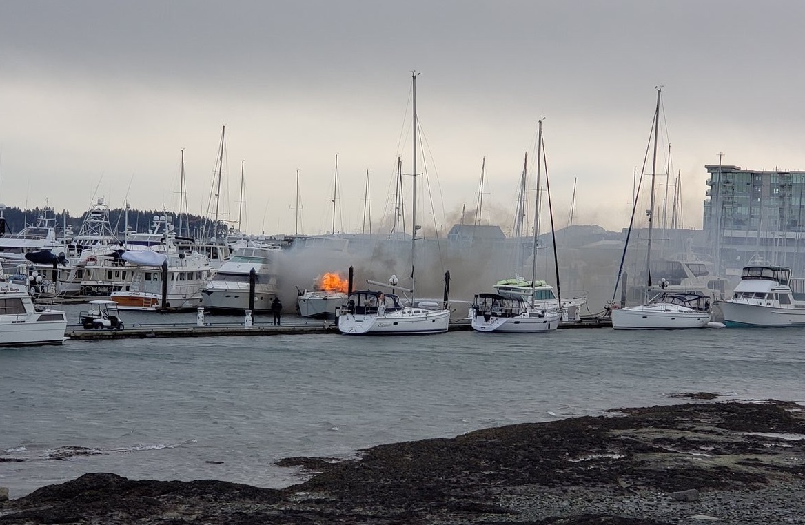 Firefighters work to extinguish a yacht fire in Sidney.