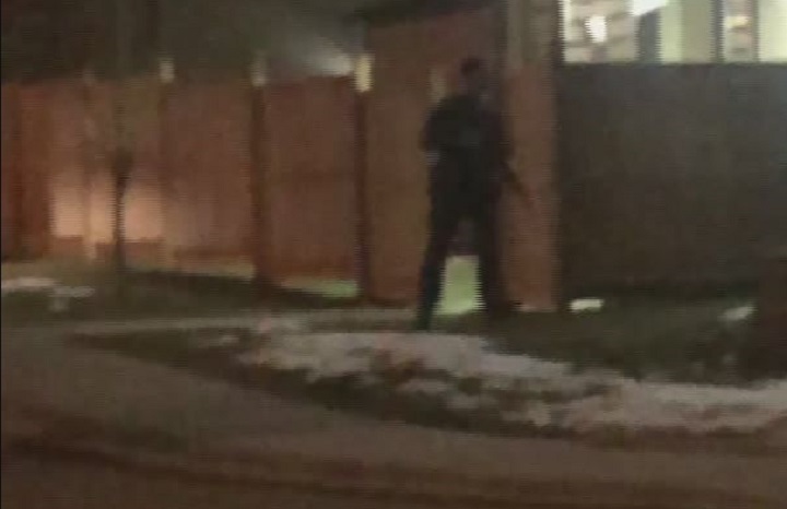 Police surround a home in Maple Ridge on Wednesday night. 