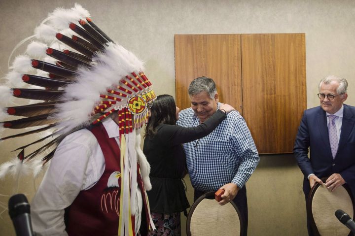Chief Archie Waquan, left to right, former Chief Steve Courtoreille with Director of Government and Industry relations Melody Lepine, and lead counsel Robert Janes leave after holding a press conference to respond to the Supreme Court of Canada's decision on Courtoreille v. Canada in Edmonton, Alberta, on Thursday, Oct.11, 2018. 