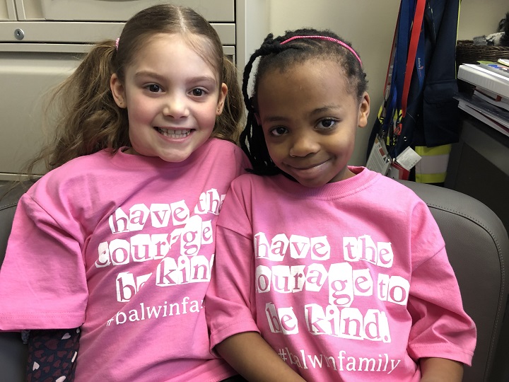 Grade 2 students at Balwin School, Naomi Kisabo and Mary-Lynn McInnes pose together on Pink Shirt Day
